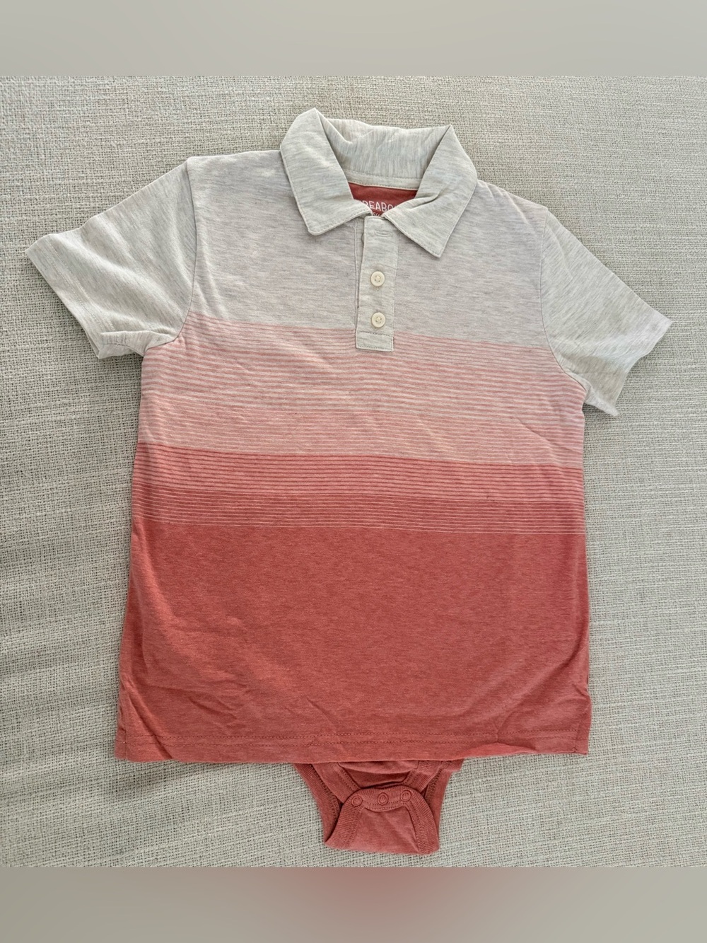 Thereabouts Adaptive Polo Bodysuit in pink gradient size xs.